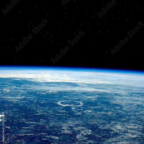 Planet Earth view from space, black starry sky on the background
