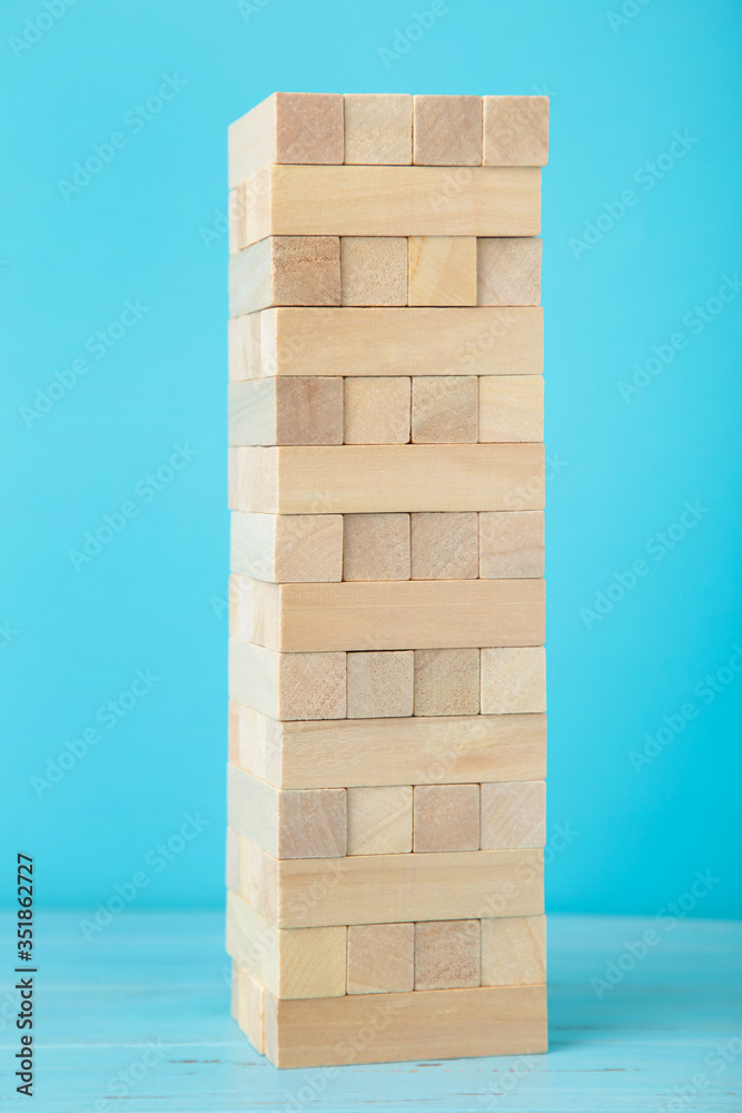 Blocks of wood on blue background. Tower Blocks of wood on blue background. Tower