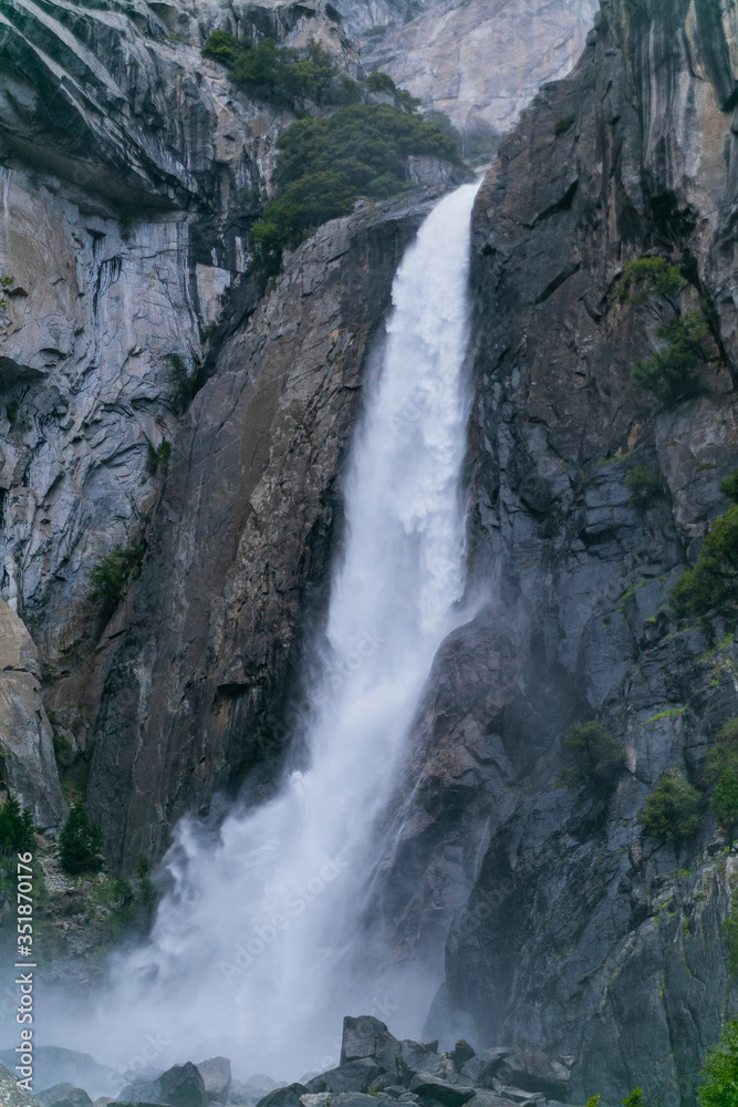waterfall in Yosemite National Park in sunny weather blue sky with clouds