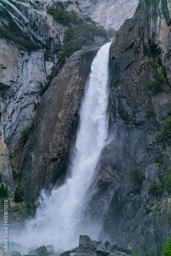 waterfall in Yosemite National Park in sunny weather blue sky with clouds