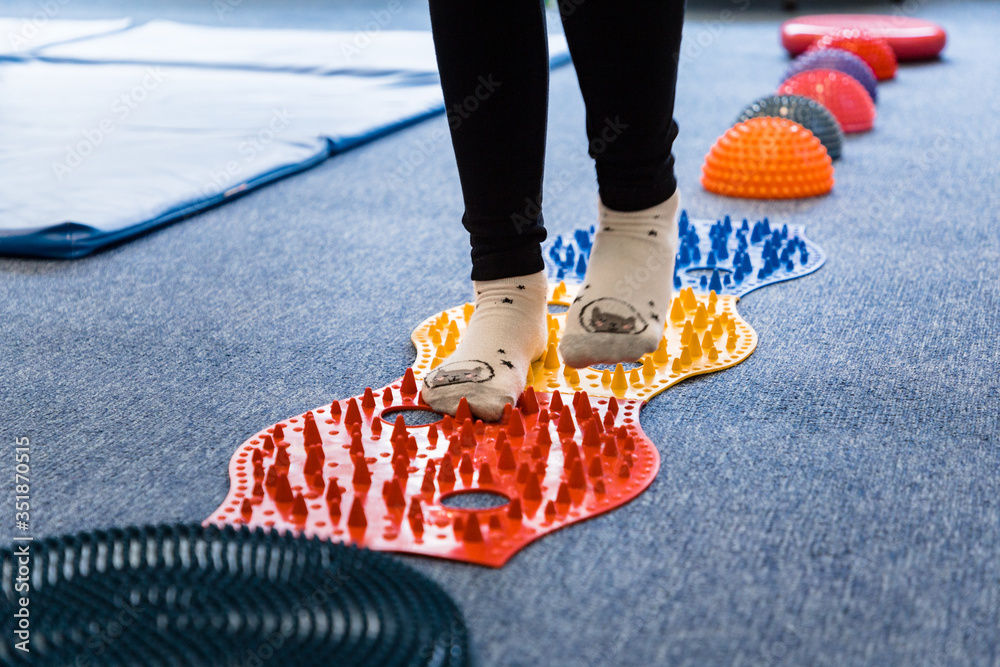 Pediatric Sensory Integration Therapy a child walking on a sensory
