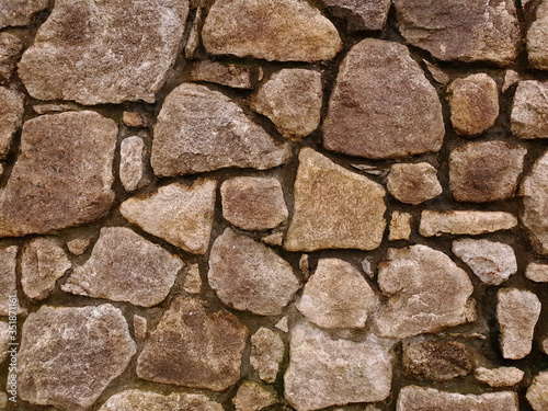 Natural stone wall background. Fence detail. Horizontal view.