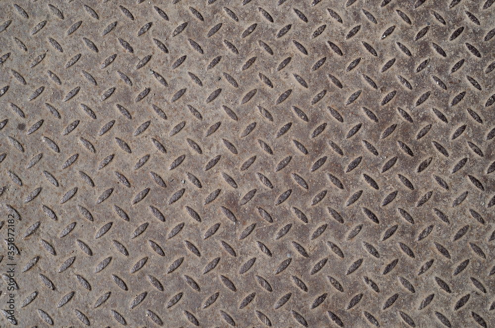 Old industrial metal plate with diamond pattern. Texture. Background. Old industrial metal plate with diamond pattern. Texture. Background.