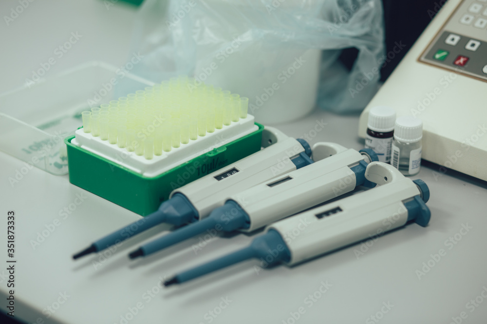 Three manual volume pipettes and tips for them Three manual volume pipettes and tips for them