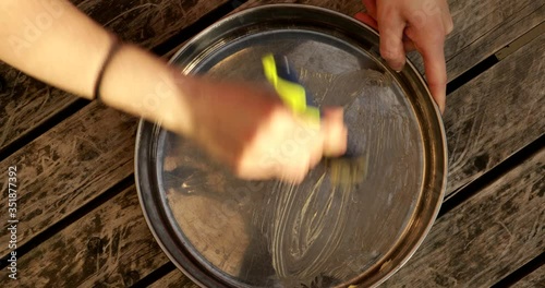 Spreading butter in a pan
