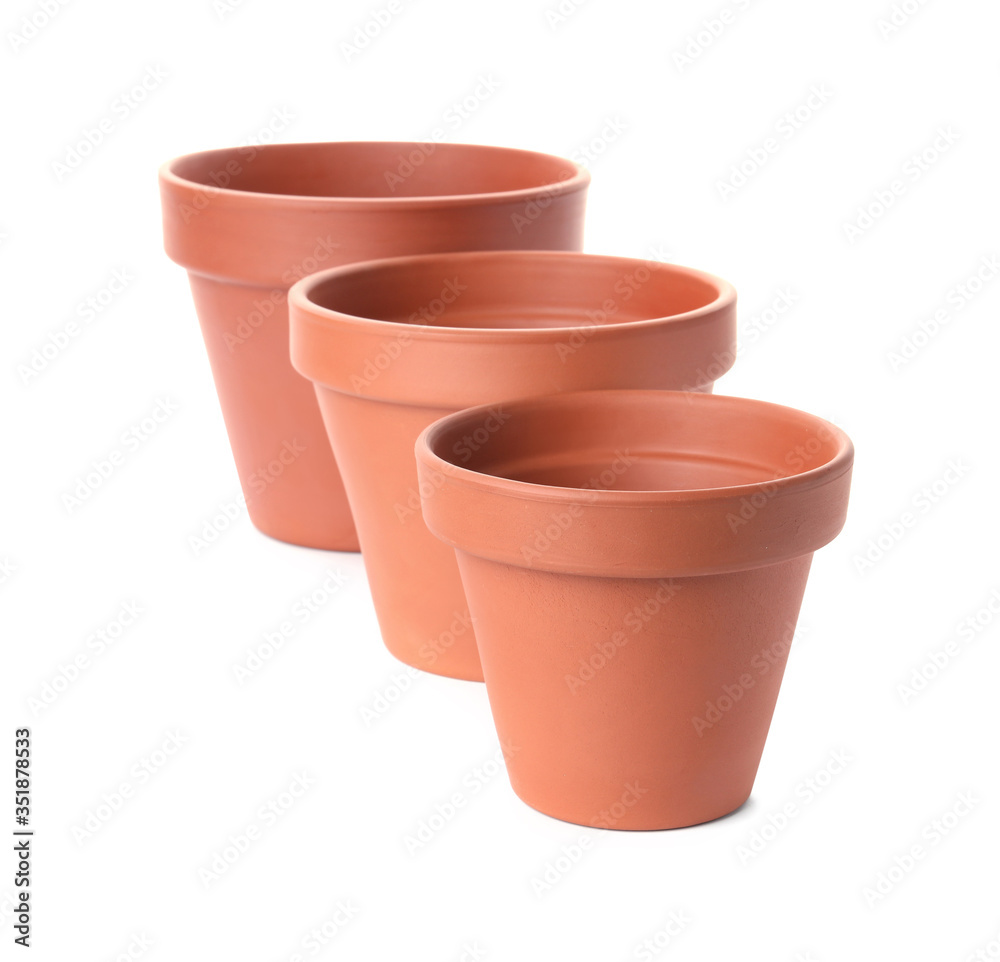 Stylish terracotta flower pots isolated on white Stylish terracotta flower pots isolated on white