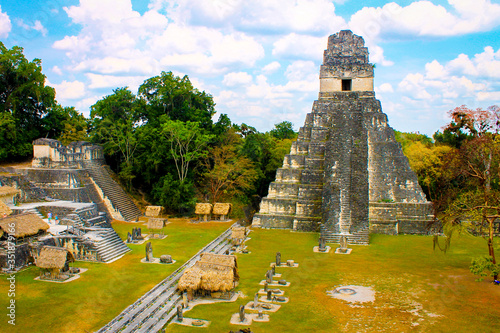 Tikal National Park on Unesco World Heritage. The Grand Plaza with the North Acropolis and Temple I (Great Jaguar Temple)