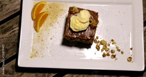 Top view of Sliced piece of carrot cake on a plate