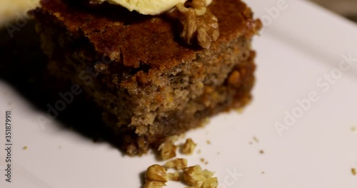 Sliced piece of carrot cake on a plate