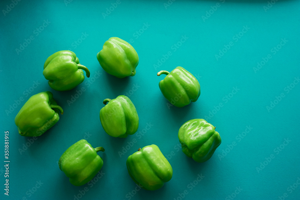Bulgarian peppers are green on a green background. Fresh and crunchy. Vegetarian food. Bulgarian peppers are green on a green background. Fresh and crunchy. Vegetarian food.