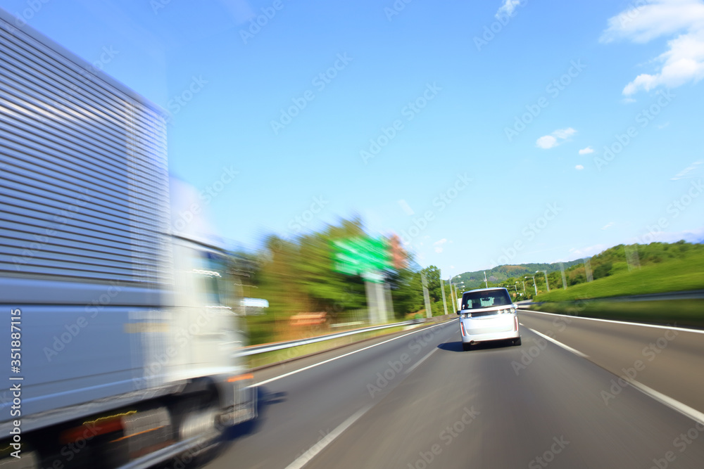 Speeding truck on the highway, motion blur