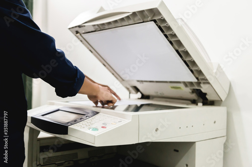 Business people keypad hand on the panel printer, printer, scanner, laser copier, office equipment, concept, start working