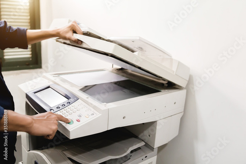 Business people keypad hand on the panel printer, printer, scanner, laser copier, office equipment, concept, start working