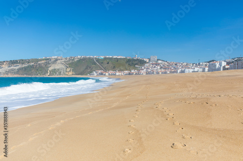 Traces on the sand of the beach in Nazare Portugal