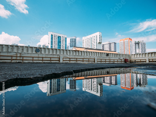 puddle reflections of singapore skyline