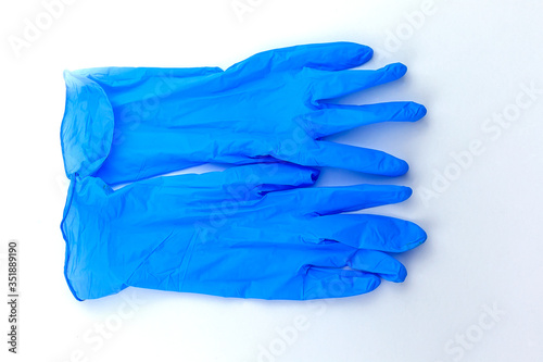 Blue surgical glove isolated on white background. © Светлана Винокурова