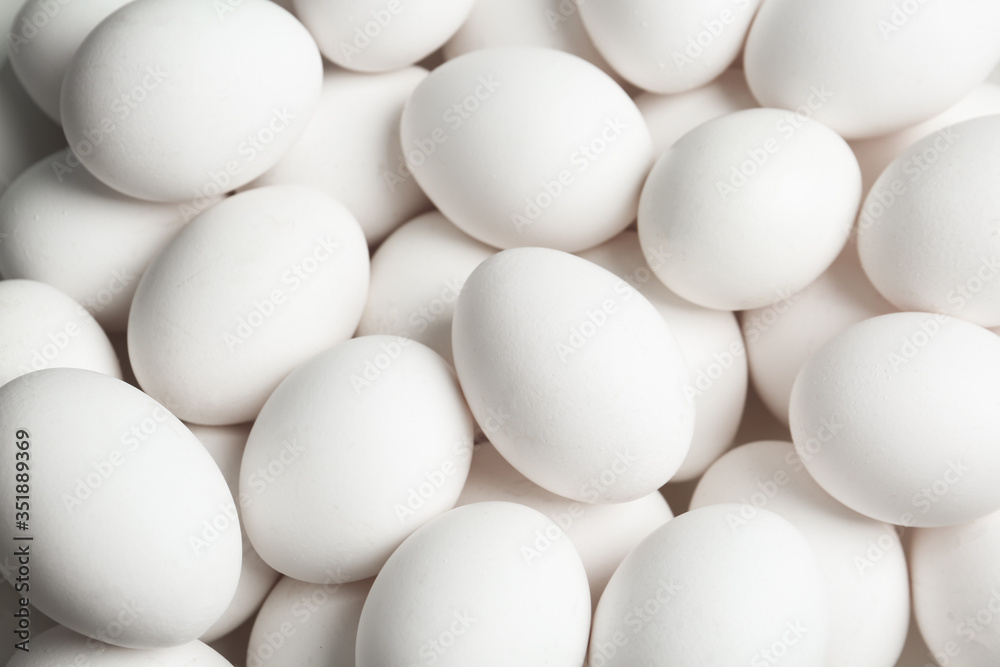Fresh raw white chicken eggs as background, above view Fresh raw white chicken eggs as background, above view