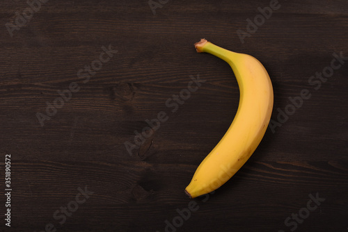 Banana on black woodwn background