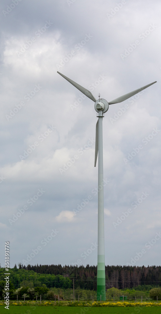 single wind turbine on a piece of meadow single wind turbine on a piece of meadow