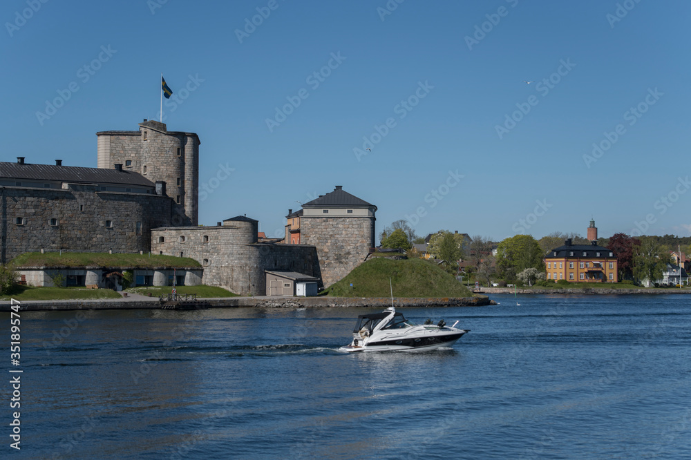 The castle Vaxholmsfästning in the town Vaxholm in Stockholm archipelago a sunny spring morning. The castle Vaxholmsfästning in the town Vaxholm in Stockholm archipelago a sunny spring morning.
