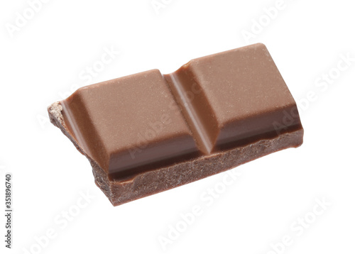 Piece of delicious milk chocolate isolated on white