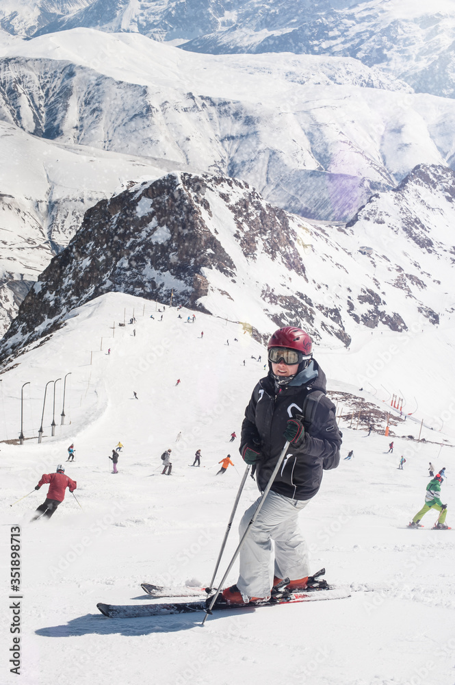 Female skier enjoy in beautiful snowy alps mountain range scenic. Winter season sport and recreation travel concept