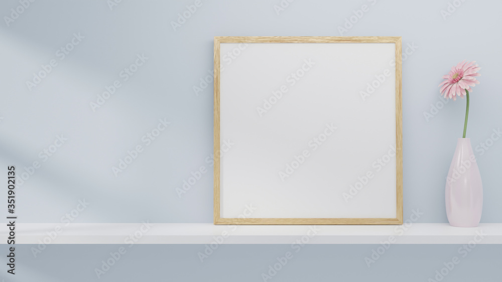 A blank picture and poster frame set on a shelf on the wall. - obrazy, fototapety, plakaty 