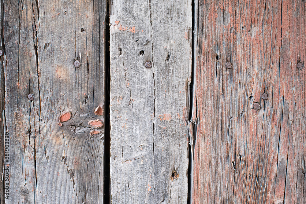 The texture of the boards. Brown painted fence. The texture of the boards. Brown painted fence.