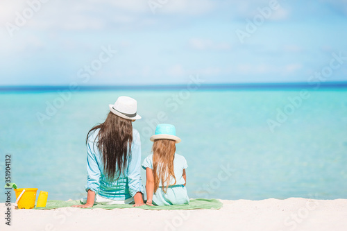 Fototapeta Naklejka Na Ścianę i Meble -  Beautiful mother and daughter at Caribbean beach enjoying summer vacation.