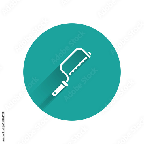 White Hacksaw icon isolated with long shadow. Metal saw for wood and metal. Green circle button. Vector