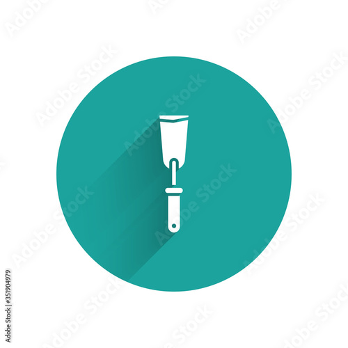 White Putty knife icon isolated with long shadow. Spatula repair tool. Spackling or paint instruments. Green circle button. Vector