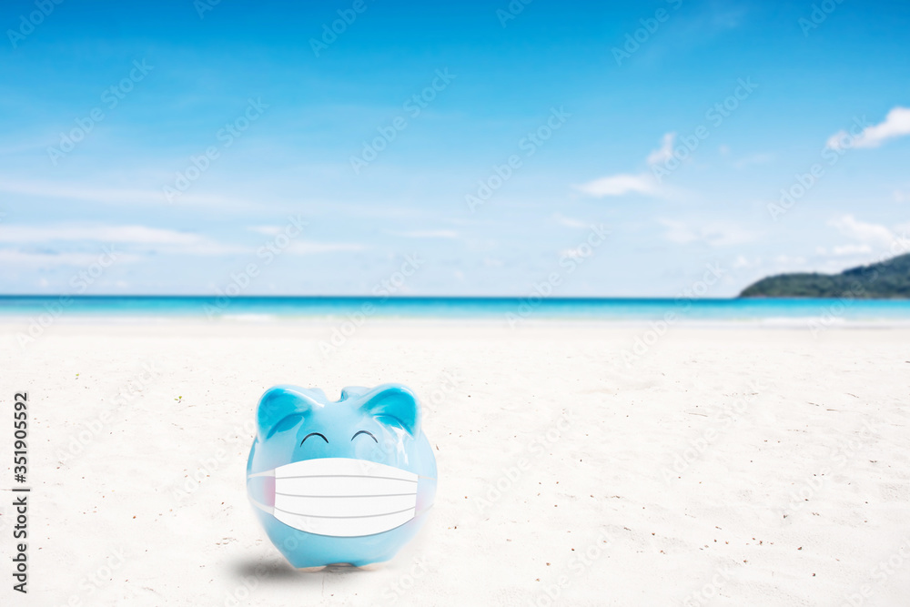 summer piggy bank on the beach,abstract background to saving for holiday vacation concept. summer piggy bank on the beach,abstract background to saving for holiday vacation concept.