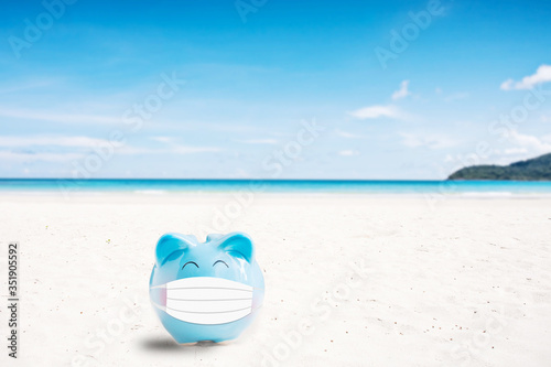 summer piggy bank on the beach,abstract background to saving for holiday vacation concept.