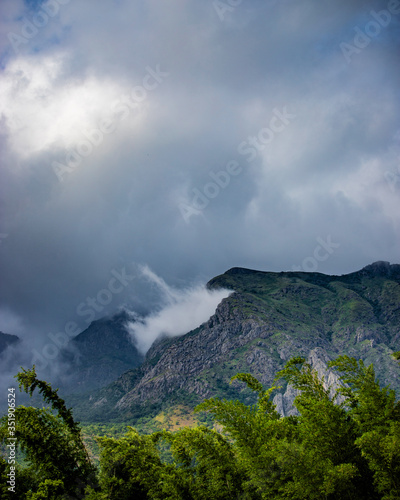 clouds hitting mountain beautiful landscape view