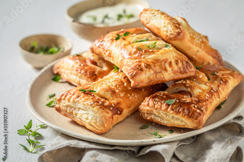 Crispy sausage roll with herbs and sesame seeds