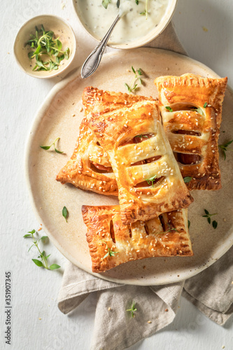 Delicious puff pastry with sausage and thyme photo