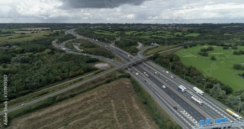 Motorway junction with bridge, M25 and M1. Busy with fast moving cars photo