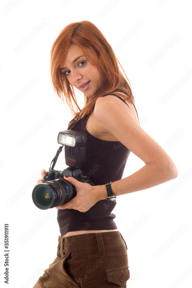 Smiling young girl holding camera, isolated on white background Smiling young girl holding camera, isolated on white background