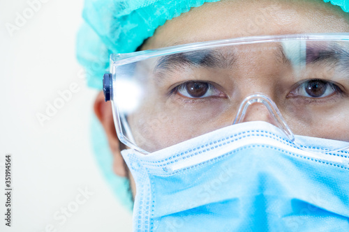 close up portrait  doctor with mask and headset ready for work in hospital.coronavirus concept.