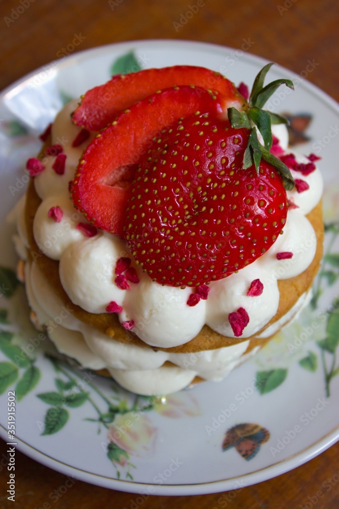 Appetizing cake with strawberry on plate Appetizing cake with strawberry on plate