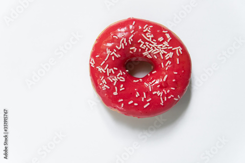 Appetizing sweet donut on a white background. Top view