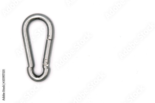 A carabiner or karabiner is a specialized type of shackle, a metal loop with a spring-loaded gate used to quickly and reversibly connect components, most notably in safety-critical systems.