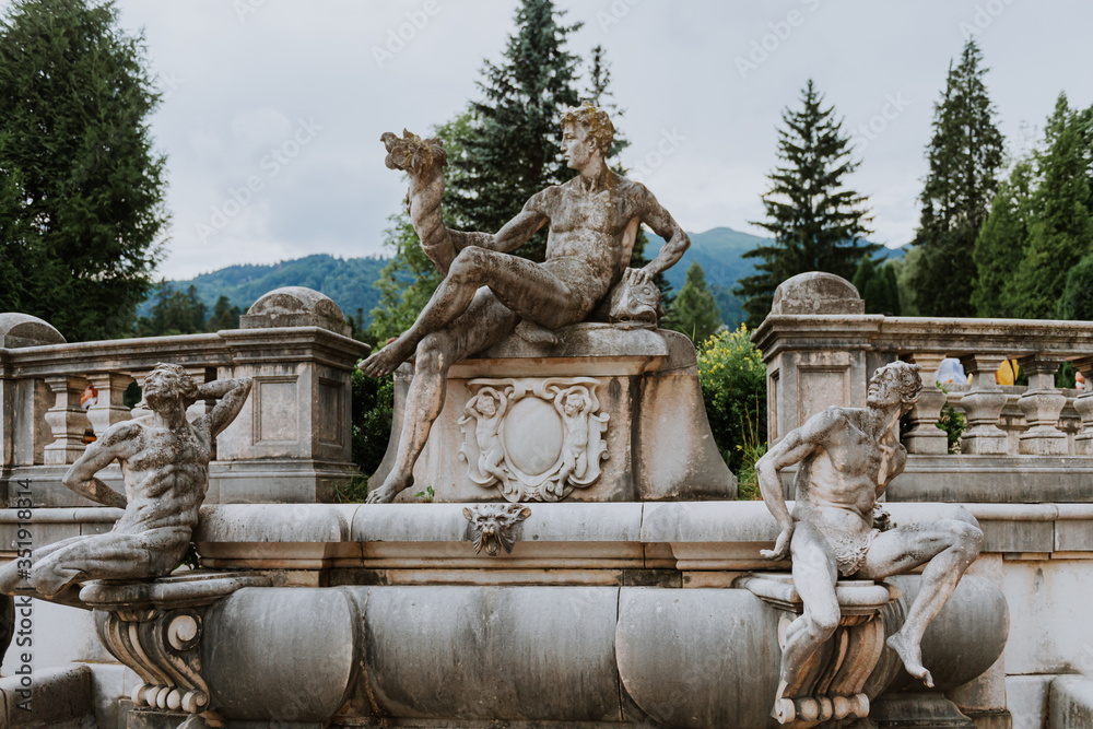 Statue in Peles Castle garden, Sinaia, Romania. Discover Romania concept