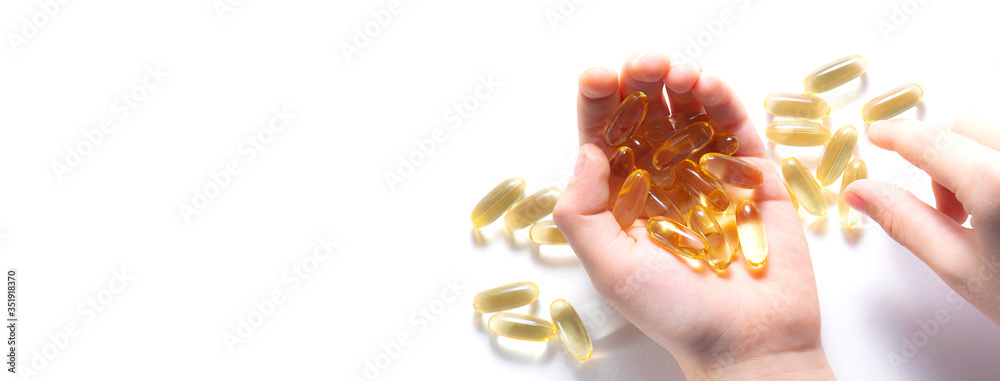 background, beauty, capsule, capsules, care, cod, cod liver oil, concept, copy space, diet, dosage, dose, drug, fat, fish, fish oil, gel, hand, health, health care, healthy, healthy lifestyle, isolate