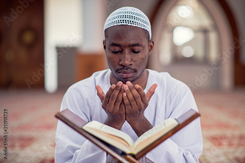 Photography Religious black muslim man praying inside the mosque