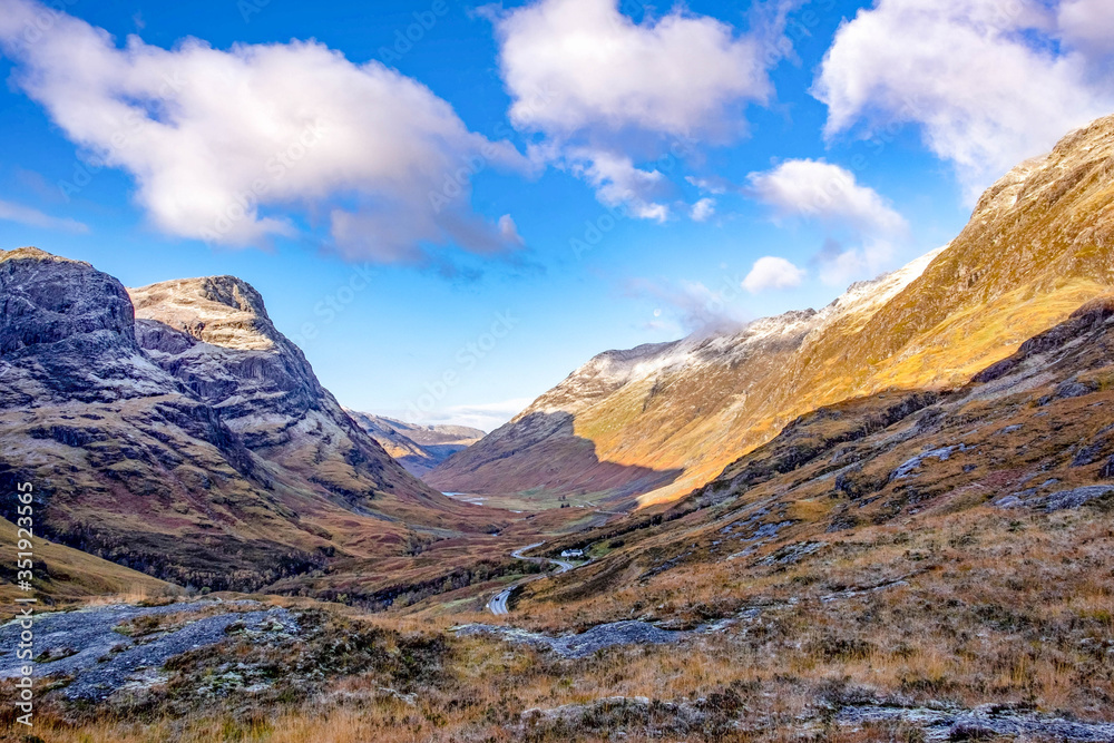 Glencoe in the dramatic highlands of scenic Scotland, fantastic adventure travel destination or holiday vacation to view picturesque scenery at sunrise or sunset