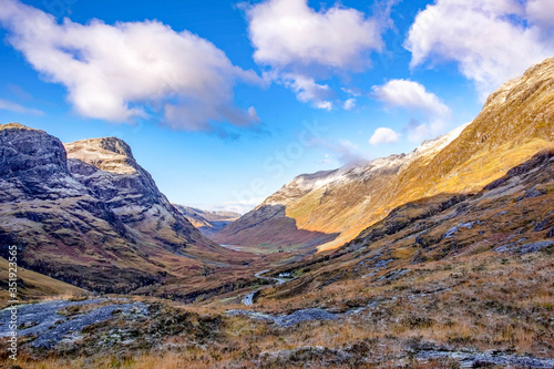 Glencoe in the dramatic highlands of scenic Scotland, fantastic adventure travel destination or holiday vacation to view picturesque scenery at sunrise or sunset