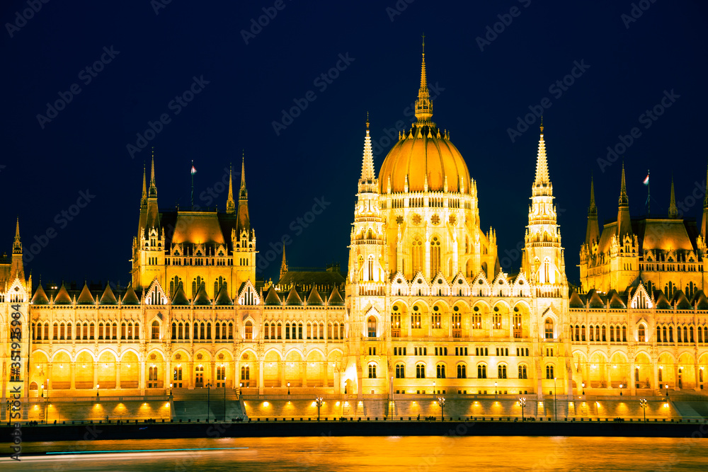 Night of Hungarian Parliament Building with Danube river in Budapest, Hungary