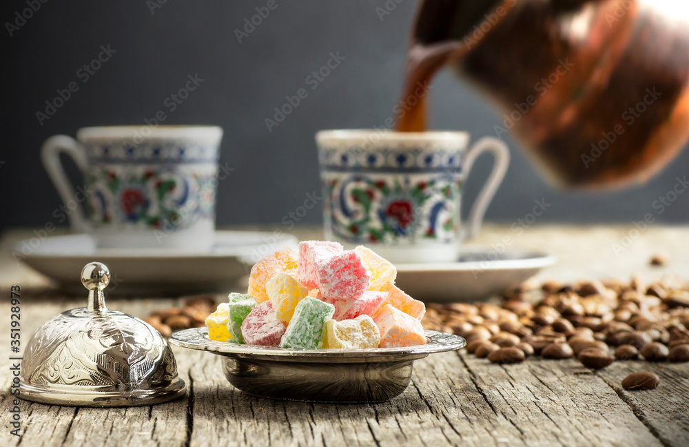 Turkish delight in hollowware and pouring turkish coffee in porcelain