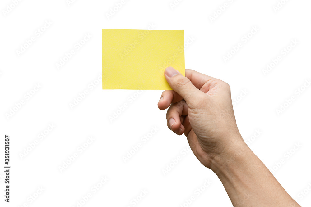 Hand holding yellow paper isolated on white with clipping path. Hand holding yellow paper isolated on white with clipping path.